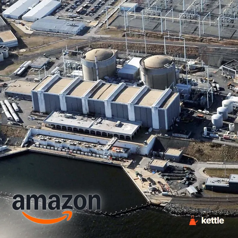 Aerial view of a nuclear power plant with the Amazon logo overlaid in the corner