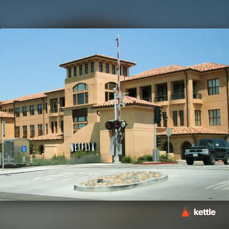 Netflix corporate headquarters building with 'NETFLIX' sign at entrance, Los Gatos, California