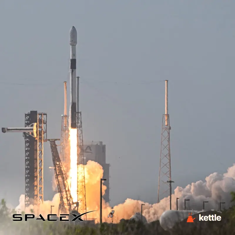 A SpaceX rocket launching from a launchpad with the SpaceX wordmark logo overlaid at bottom left